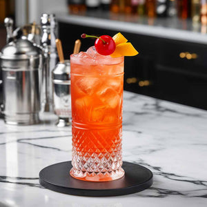 Orange Shirley Temple Virgin Cocktail Mocktail on a marble bartop