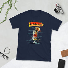 Load image into Gallery viewer, Navy blue t-shirt for men with Sex on the Beach cocktail sketched on it, laying between homey things