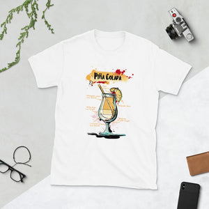 White t-shirt for men with Pina Colada sketched on it laying between homey things